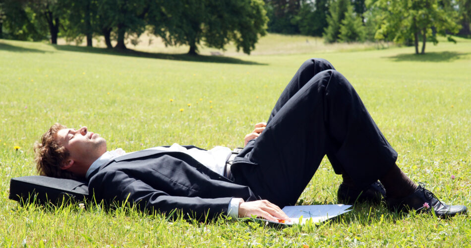 young man relax from hard work surrounded by sunny nature